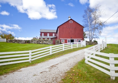 Farmhouse with white fence