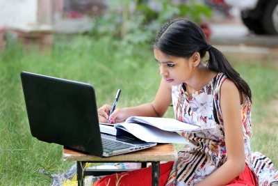 Girl using Internet for school